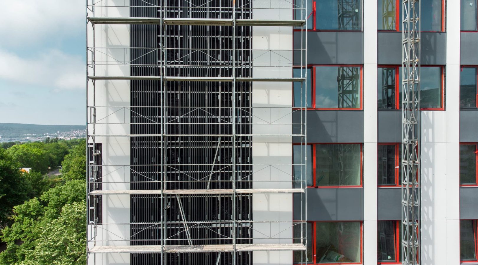 scaffolding-on-apartment-building-facade-construct-2023-11-27-05-33-25-utc (1)